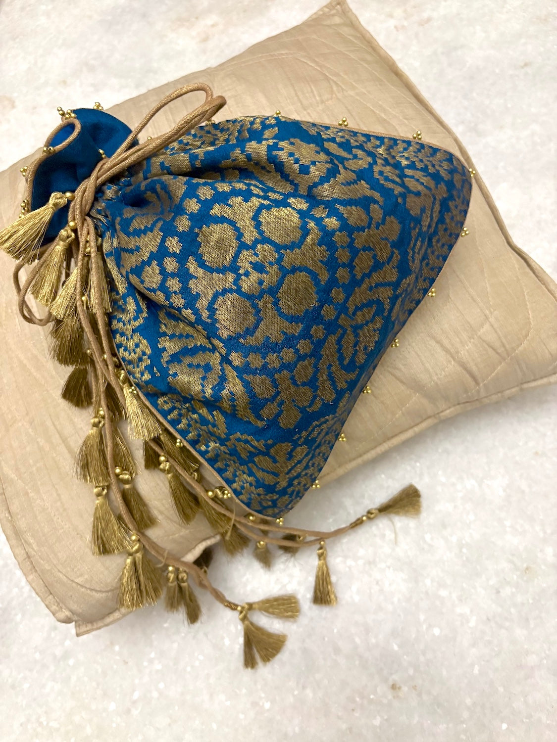 Neelmani Teal Blue Matka Georgette Potli