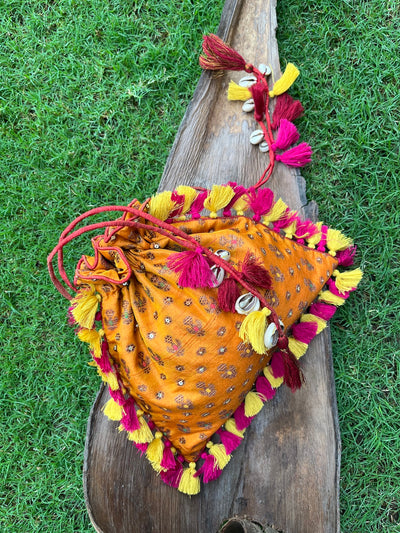 Amrapali Kesari yellow Brocade Potli