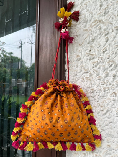 Amrapali Kesari yellow Brocade Potli
