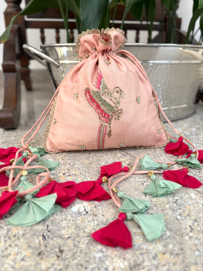 Talking Bird Powder Peach Silk Potli